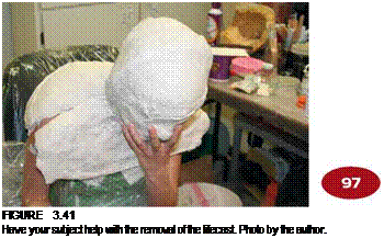 Подпись: FIGURE 3.41 Have your subject help with the removal of the lifecast. Photo by the author. 